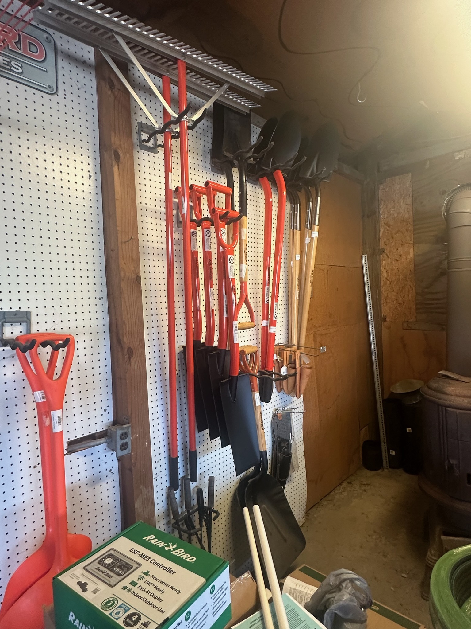 Garden tools and Rain Bird irrigation controller boxes at Still Meadow