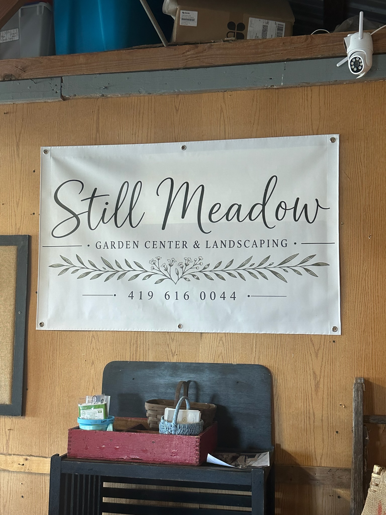 Still Meadow Garden Center and Landscaping sign with the business phone number