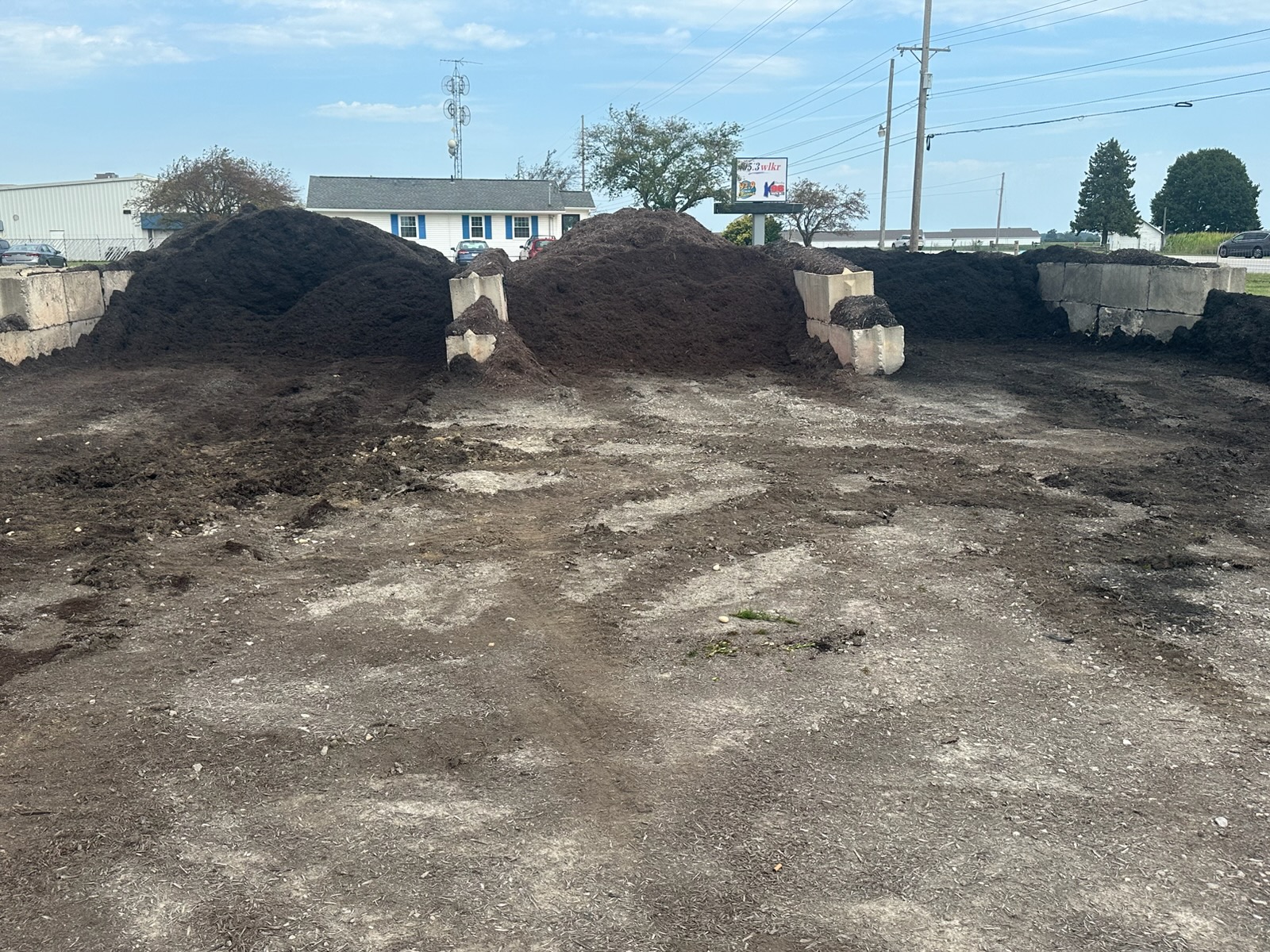 Large piles of mulch and soil ready for customer projects
