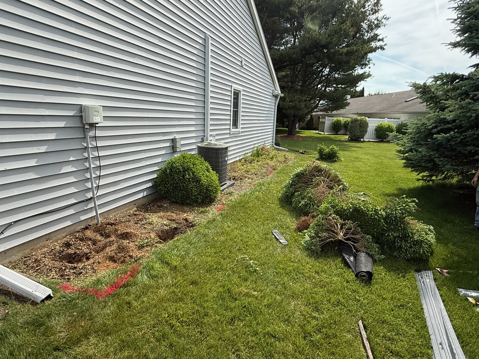 Before Still Meadow’s side-yard stone-bed project, with the old shrubs removed and the bed being prepared
